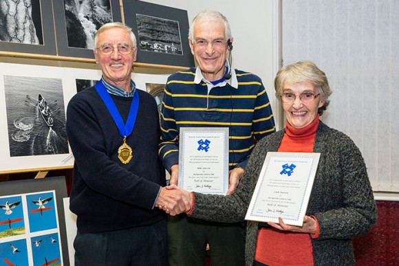 Mike & Cath Farrow receive their Rolls of Honour from John Hodge