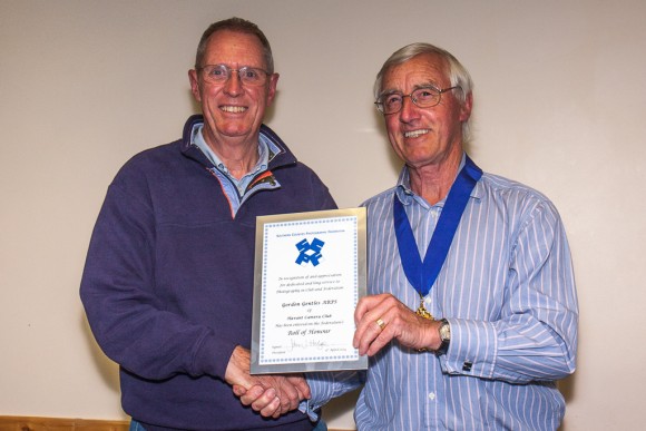 Gordon Gentles receives his roll of honour from John Hodge.