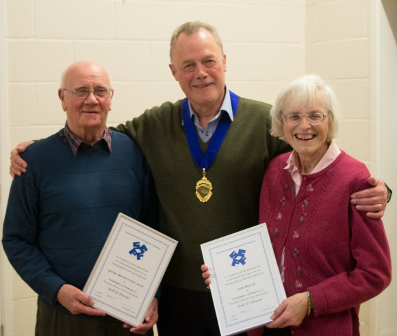 Jean Russell and George Marsh receive their rolls of honour from Tony Oliver.